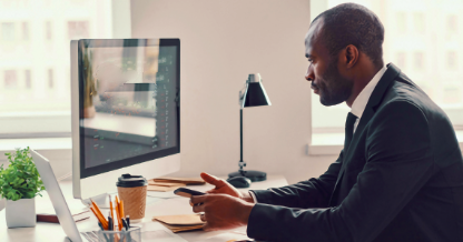 Man at desk using computer